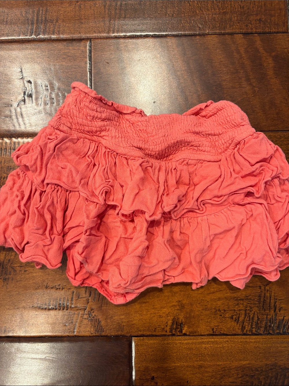 Flirty Coral Ruffle Mini Skirt with Smocked Waist